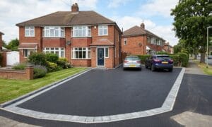 big house with a tarmac driveway