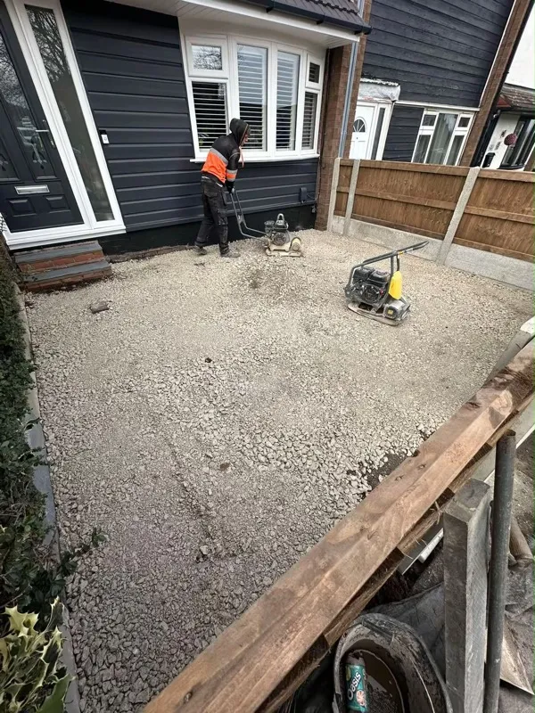 Compacted sub-base with plate compactor before block paving in Trentham